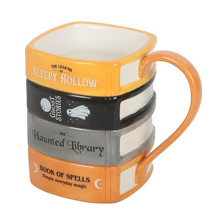 The Haunted Library Book Stack Mug designed to resemble stacked spooky books for cozy reading sessions.