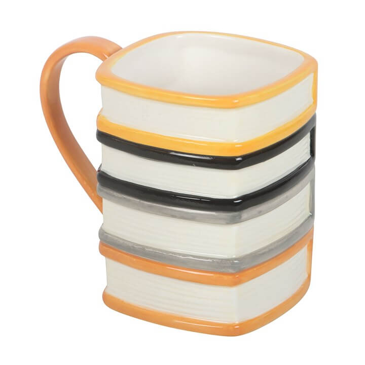 The Haunted Library Book Stack Mug designed like a stack of spooky books for cozy reading sessions.