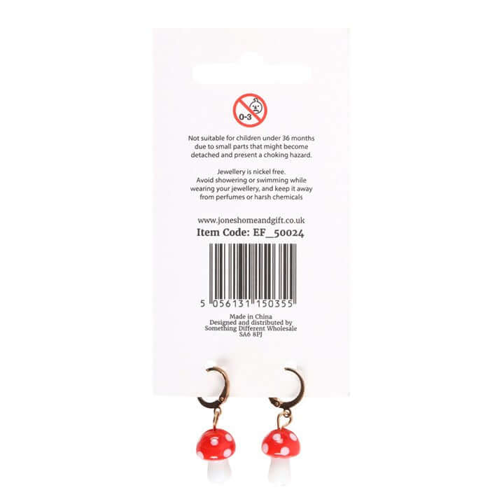 Toadstool Dangle Earrings displayed on packaging, featuring red mushroom charms and gold hoop earrings.