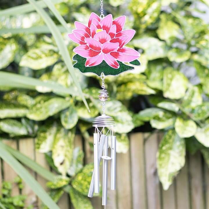 Water Lily Windchime featuring a pink flower and silver chimes, perfect for garden decor.