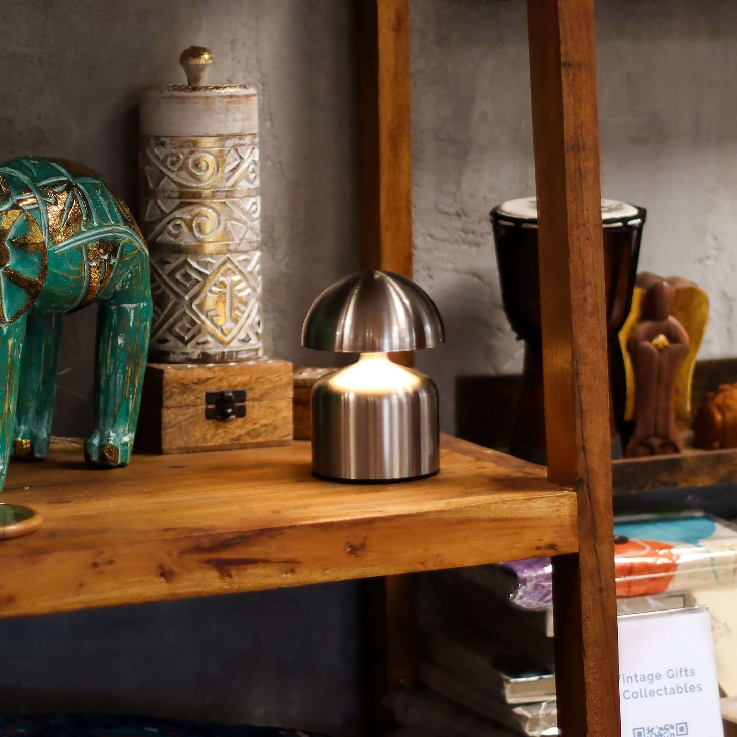 Touch Lamp Dome Mushroom Silver USB (C) Rechargeable lamp on wooden shelf with decorative items.
