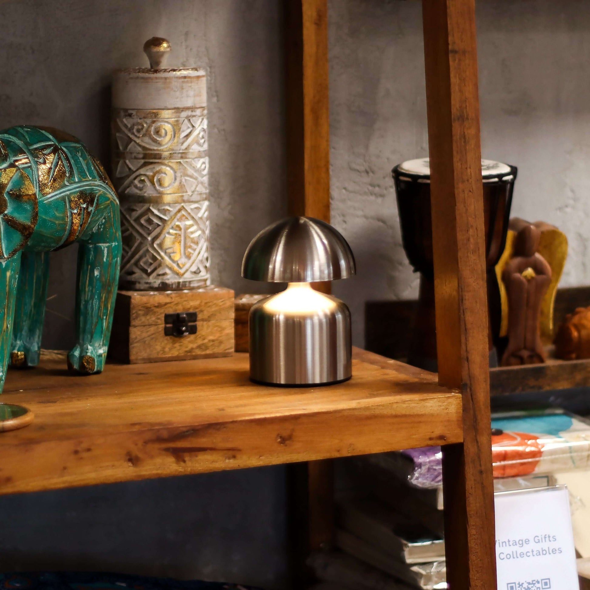 Touch Lamp Dome Mushroom Silver USB (C) Rechargeable lamp on wooden shelf with decorative items.