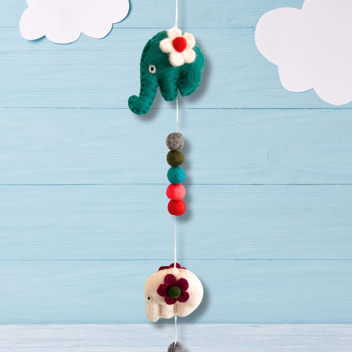 Felt Wall Hanging with colorful elephants and pom poms, perfect for children's rooms and nurseries.