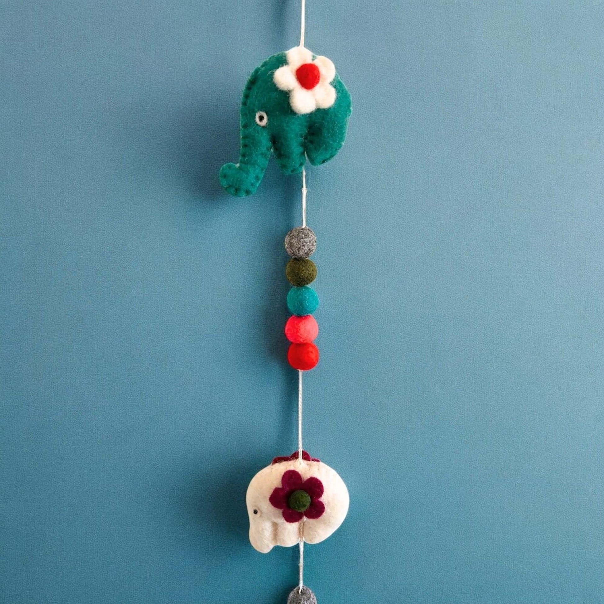 Felt Wall Hanging featuring colorful elephant designs made from soft felt materials.