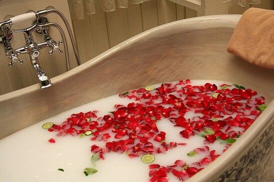 Relaxing bath with rose petals and lime slices, perfect for a soothing experience with Rose Soap Flower.