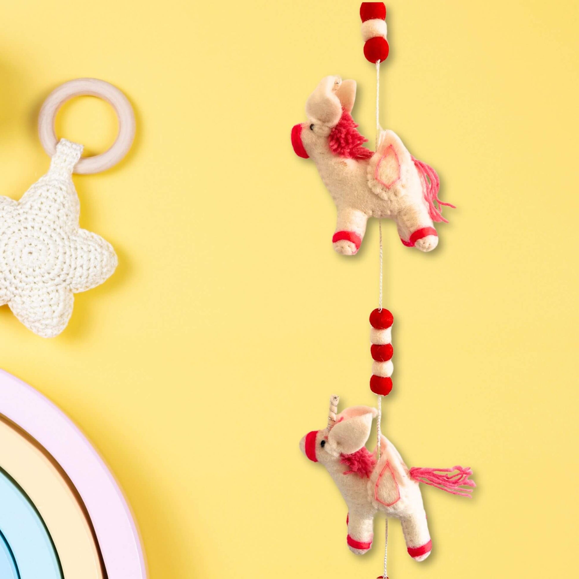 Felt Wall Hanging Unicorns hanging decor featuring charming unicorn designs in vibrant colors.