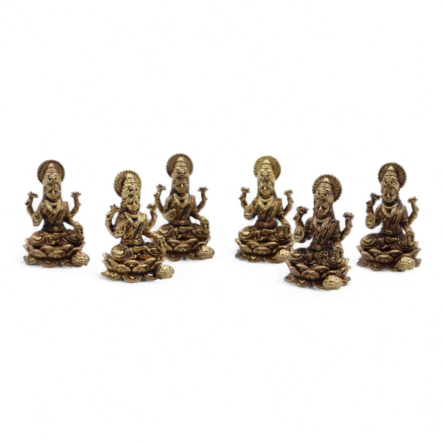 Brass Miniature Laxmi God figurines, symbolizing prosperity, arranged in a row with intricate details, showcasing skilled craftsmanship.