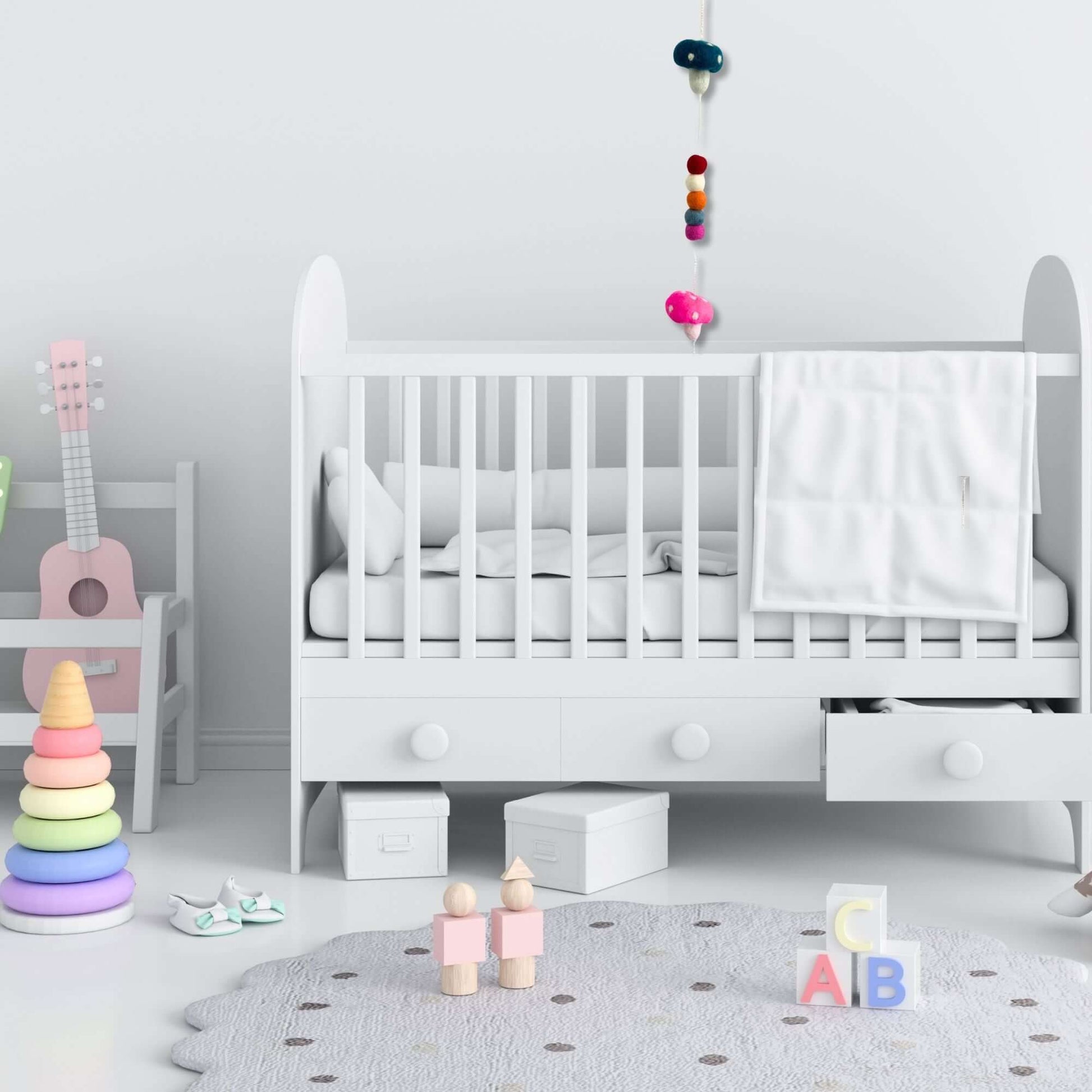 Felt Wall Hanging Mushrooms in a modern nursery with a crib, colorful toys, and a soft rug.