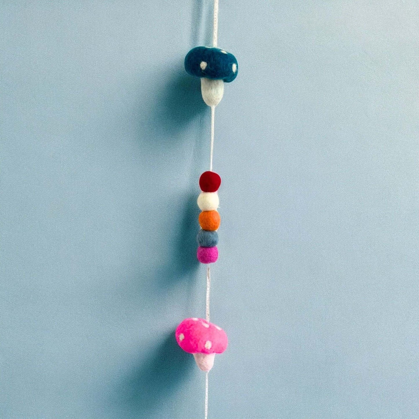 Colorful Felt Wall Hanging featuring vibrant mushrooms and decorative spheres.