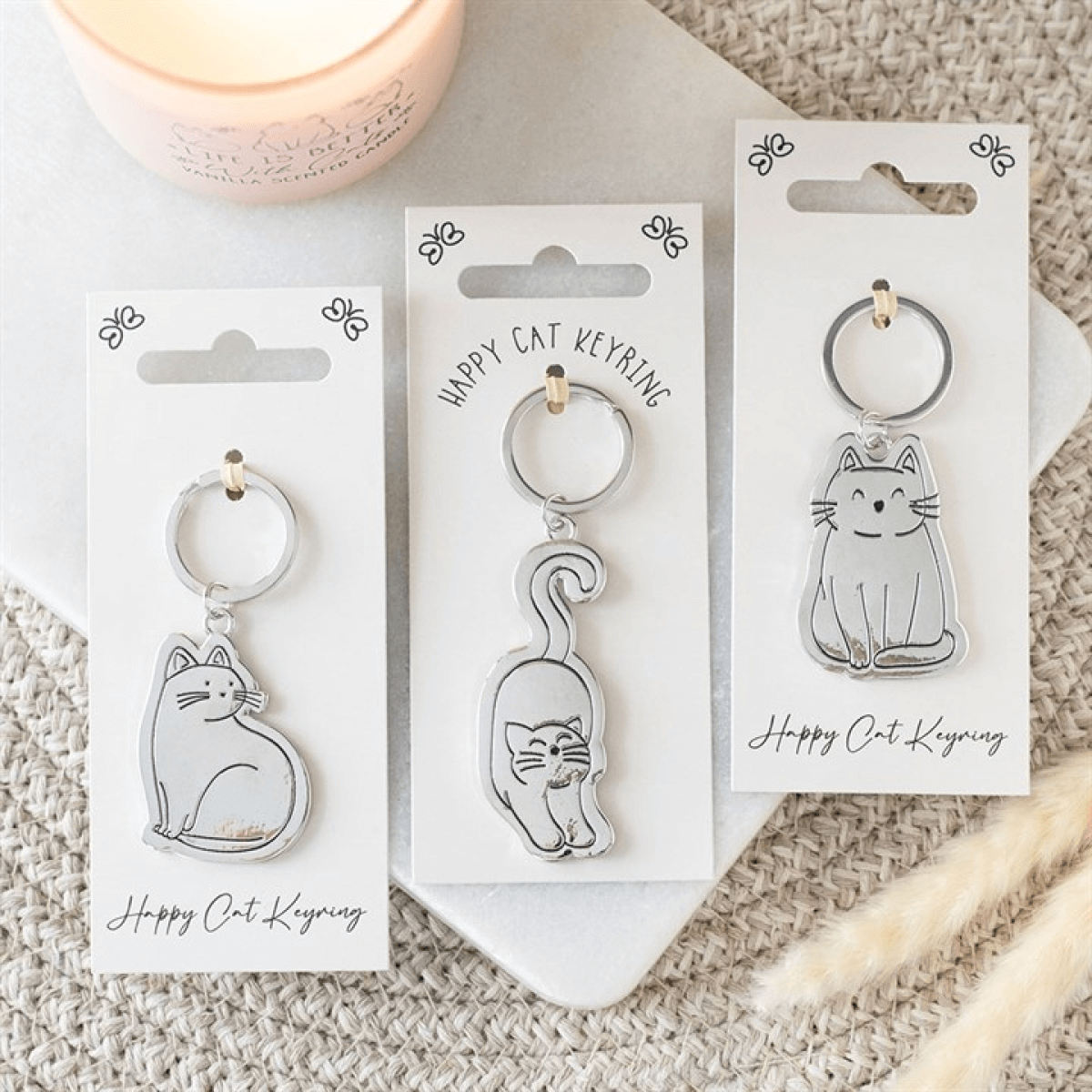 Set of 24 Happy Cat Keyrings on Display