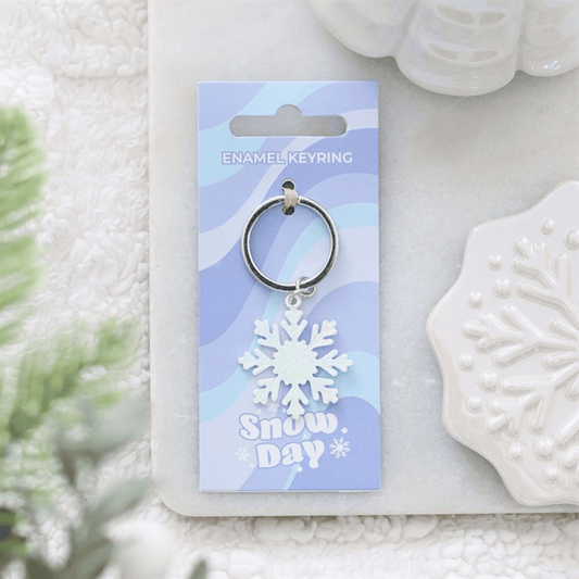 Snowflake Keyring displayed on blue card and white snowflake decor, perfect for winter accessories.