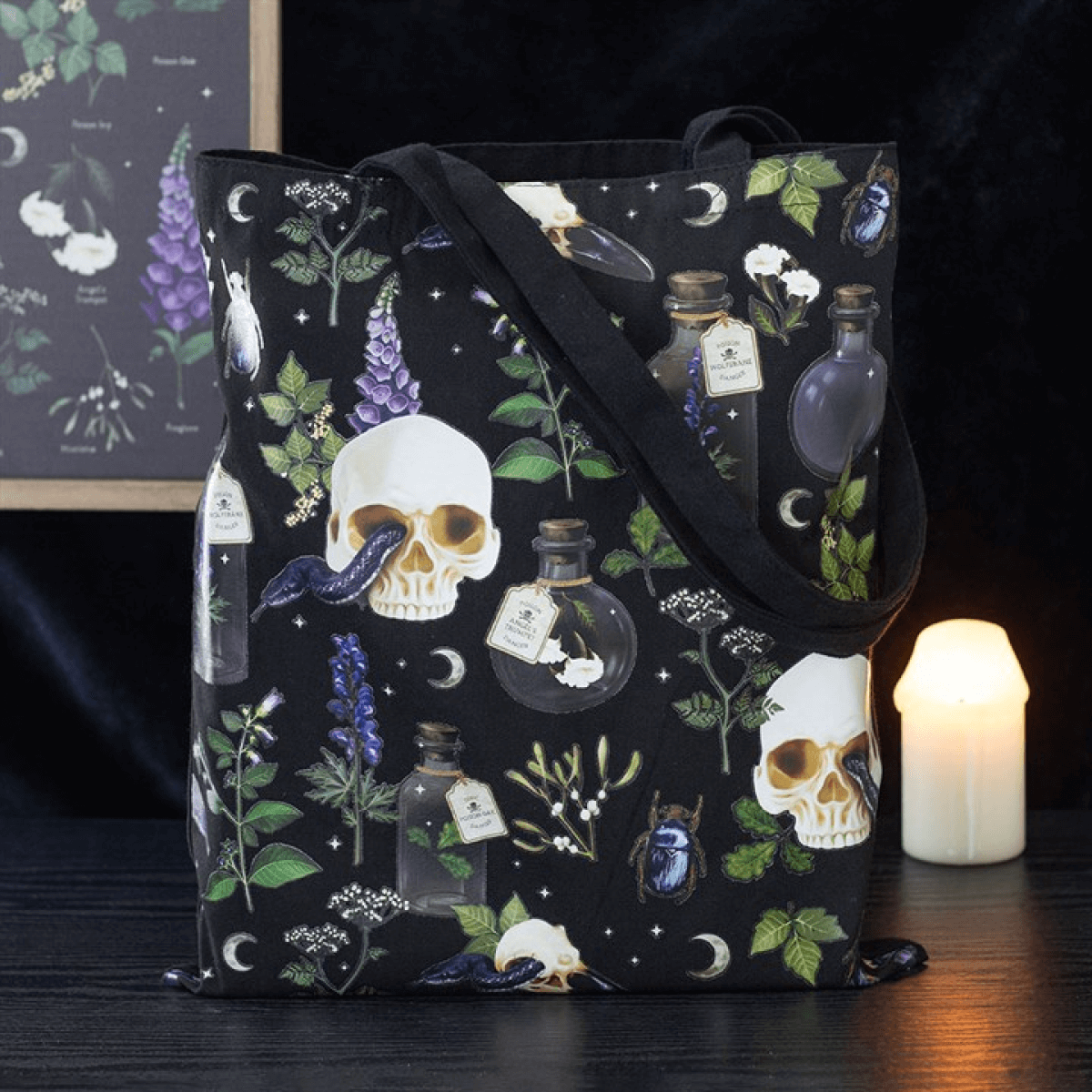 Tote bag with skull and potion design on a dark background