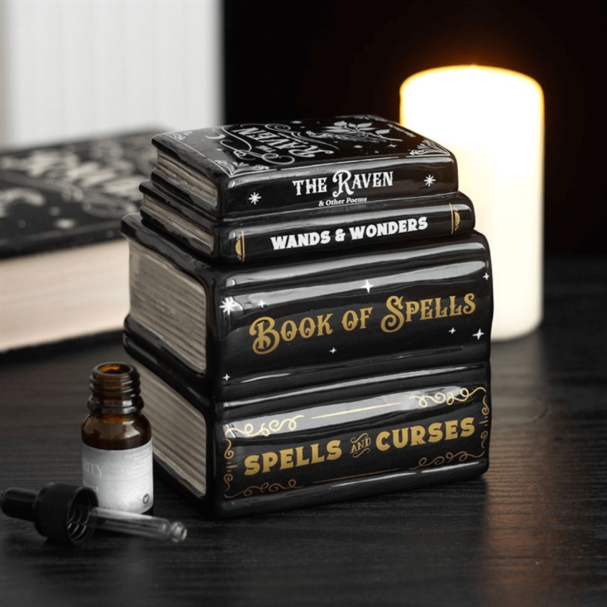 Book of Spells Oil Burner designed as a stack of spell books, perfect for gothic décor and witchy aesthetics.