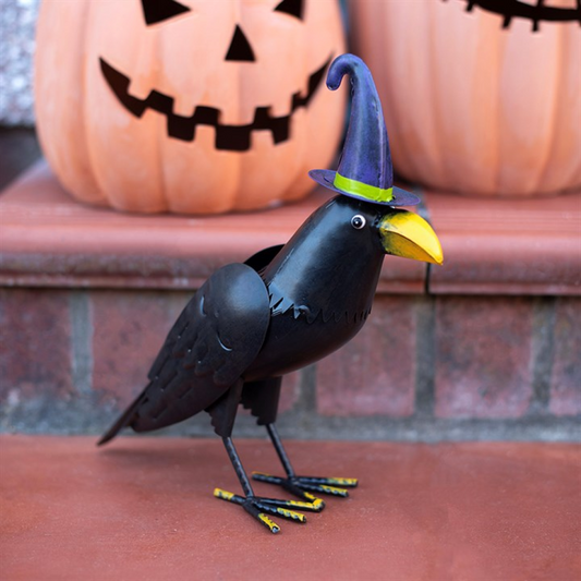 Metal raven ornament with witch hat, bright beak, perfect for Halloween decor.