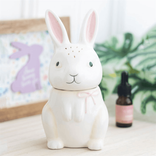 White rabbit-shaped night light on a surface with a blurred background
