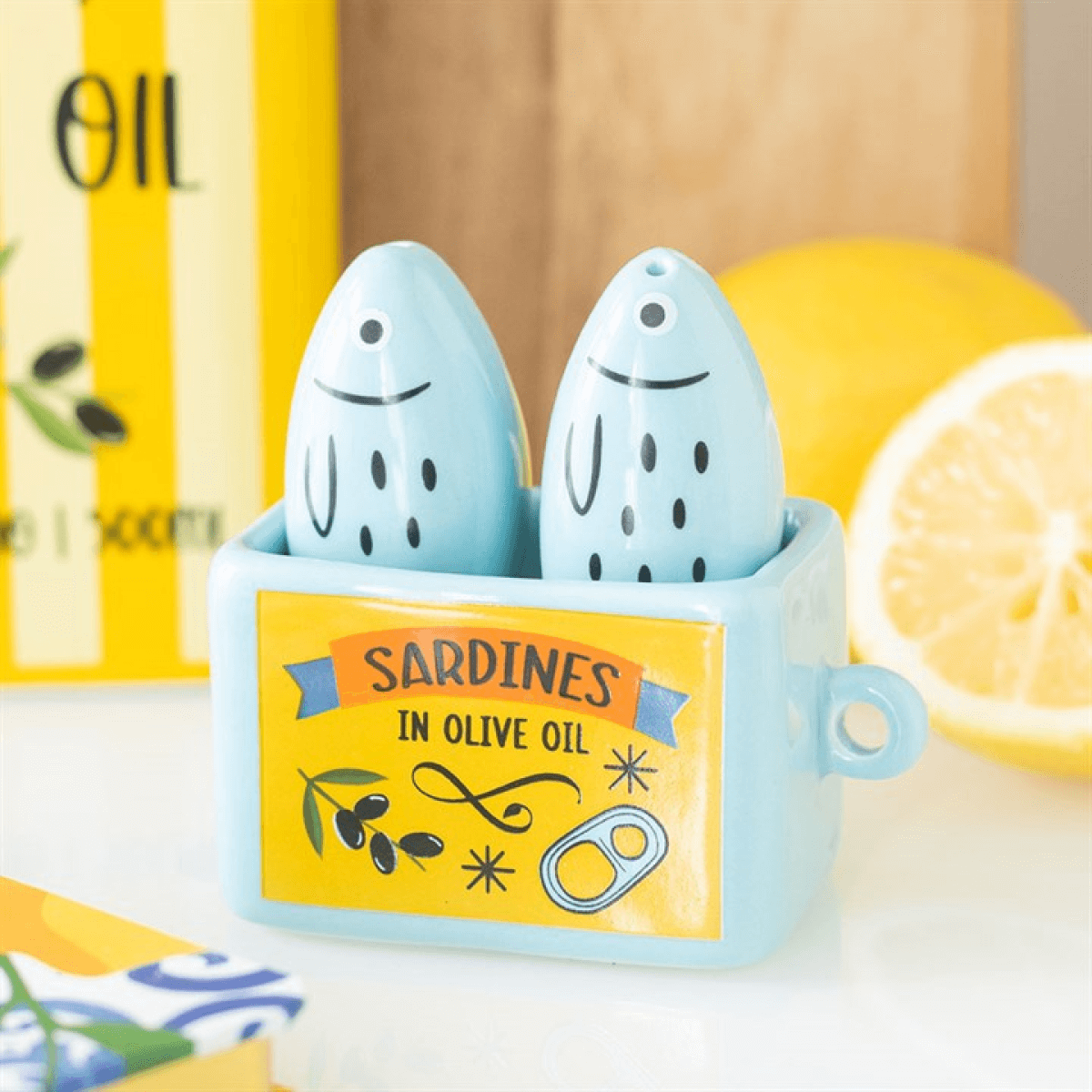 Sardine Salt and Pepper Shakers in a ceramic holder, adding a coastal charm to the kitchen.