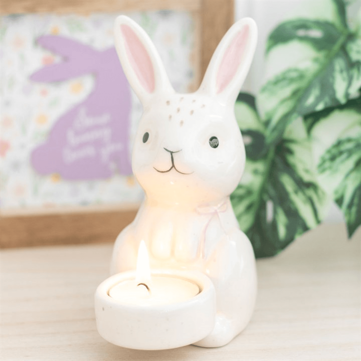 Cute rabbit-shaped night light on a surface with a blurred background