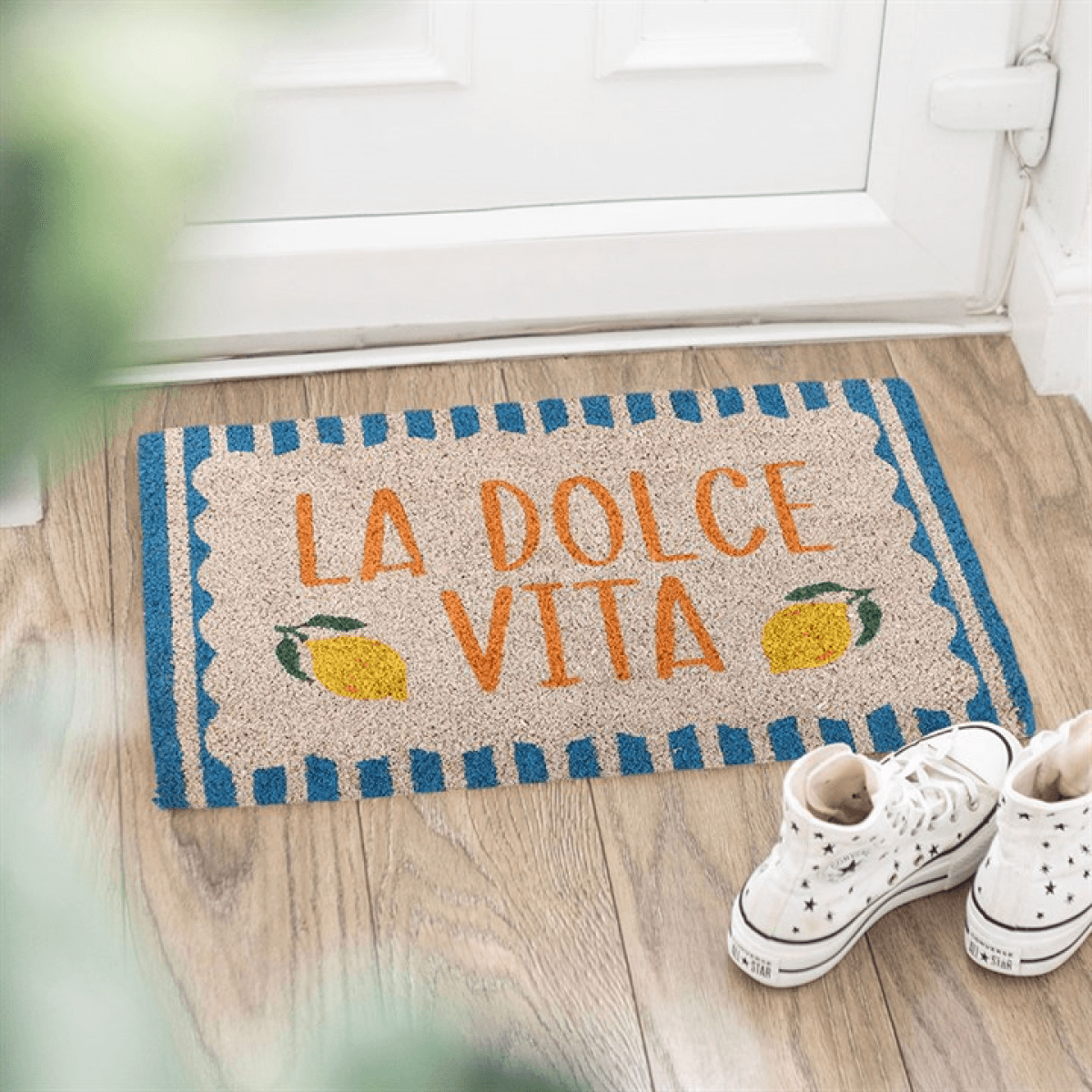 Blue La Dolce Vita Doormat with lemons and playful phrase at entryway, perfect for cheerful decor.
