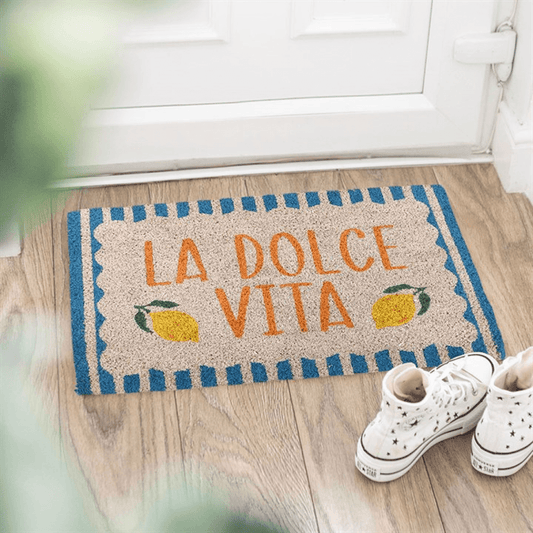 Blue La Dolce Vita Doormat with lemons and playful phrase at entryway, perfect for cheerful decor.