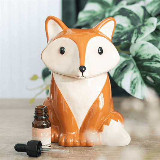 Fox-shaped container with a small bottle on a wooden surface