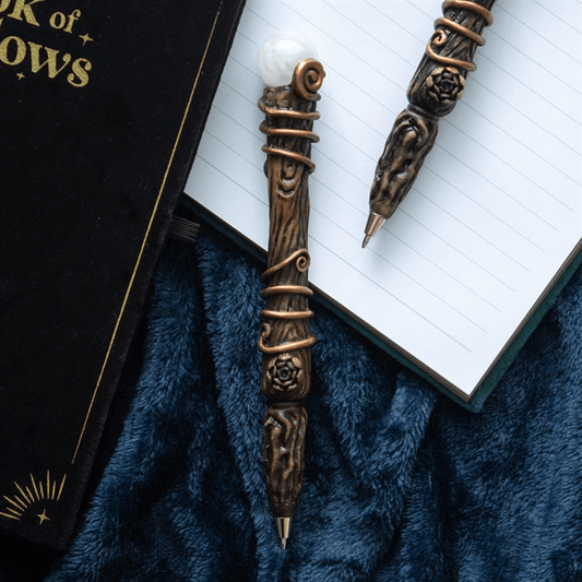 Decorative pen with intricate design on a book