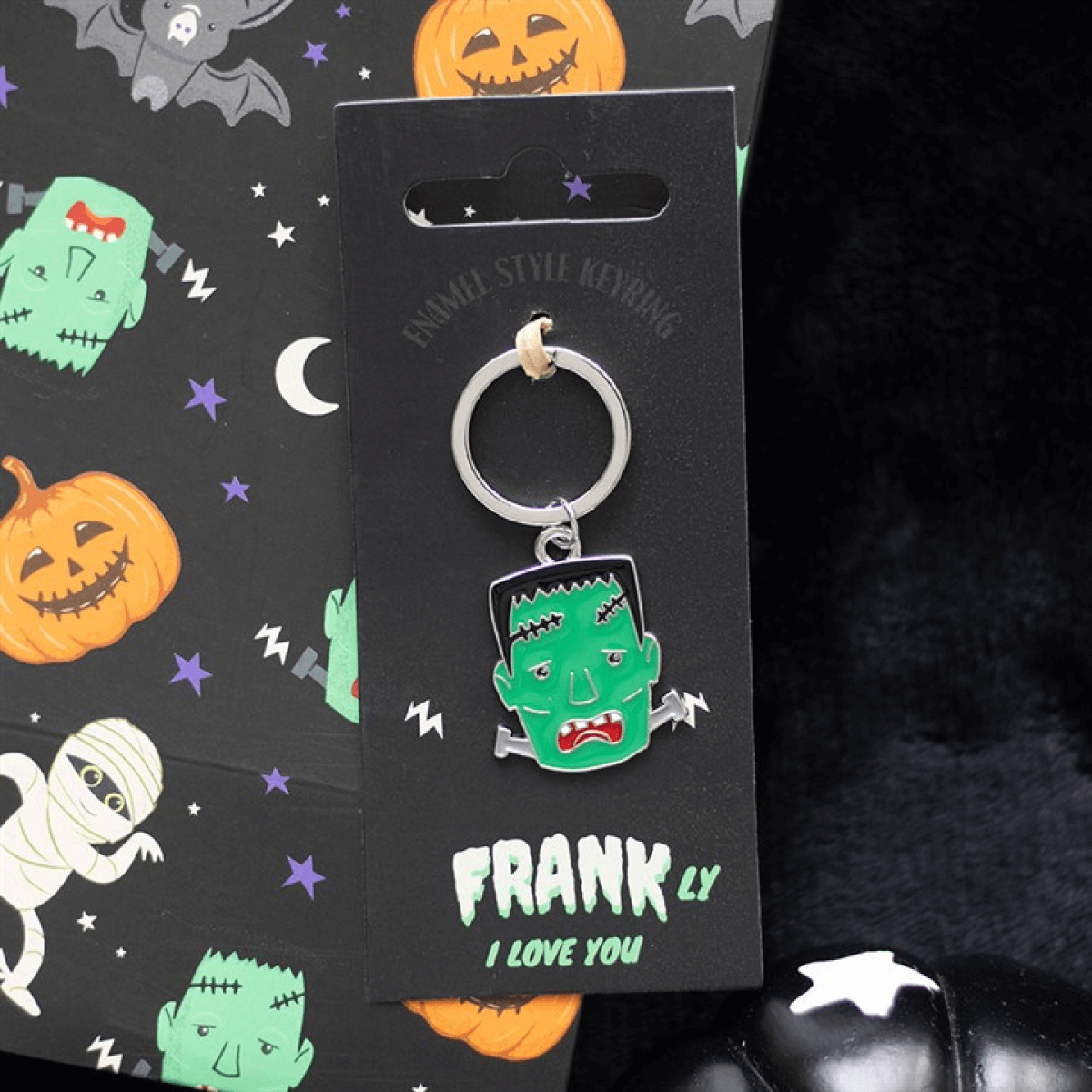 Keychain with 'Frankly I Love You' text on a Halloween-themed card