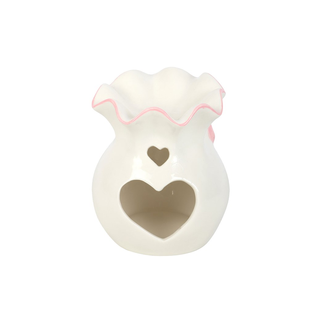 White teether with pink rim and heart design on a white background